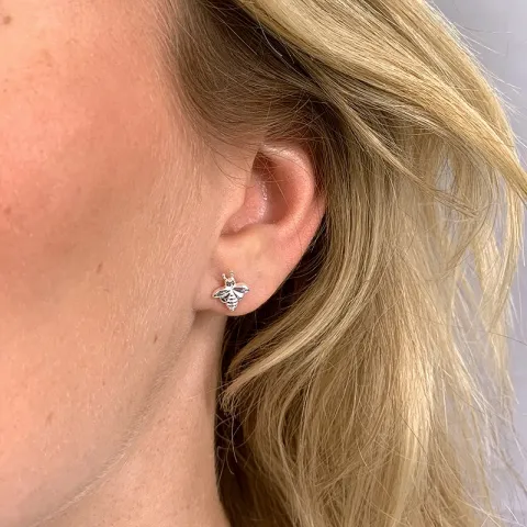 bi ørestikker i sølv