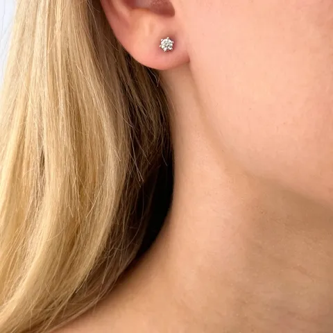 2 x 0,26 ct diamant solitaireørestikker i 14 karat hvidguld med diamant