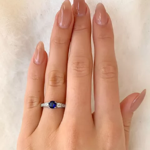 Ringe: blå zirkon ring i rhodineret sølv