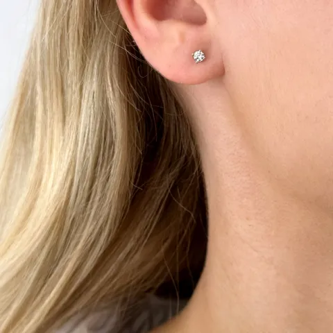 2 x 0,10 ct solitaireørestikker i 14 karat hvidguld med diamant