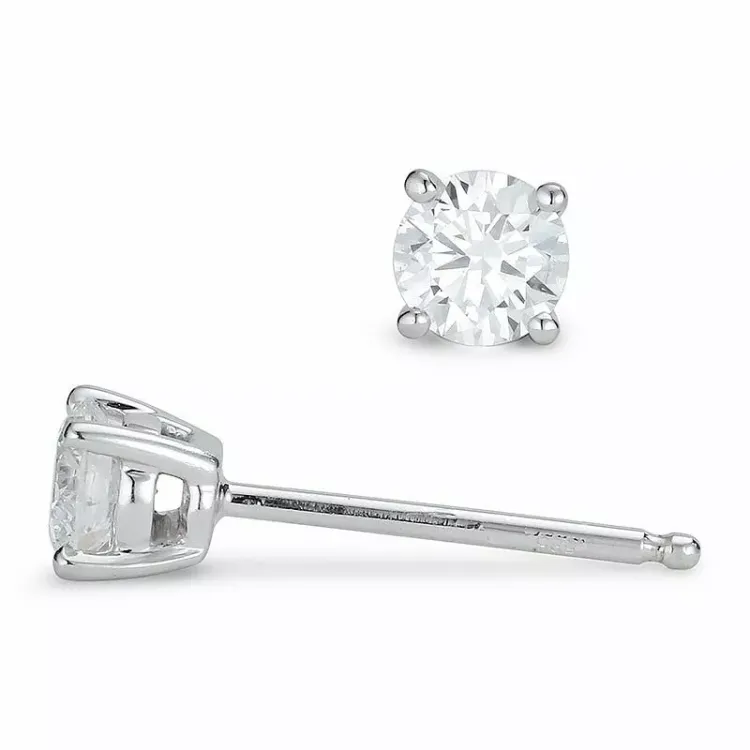2 x 0,25 ct diamant solitaireørestikker i 14 karat hvidguld med diamant