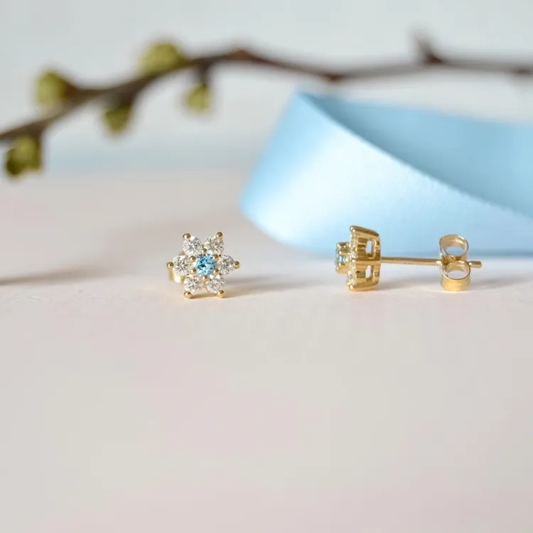 blomster topas diamantøreringe i 9 karat guld med diamant og topas