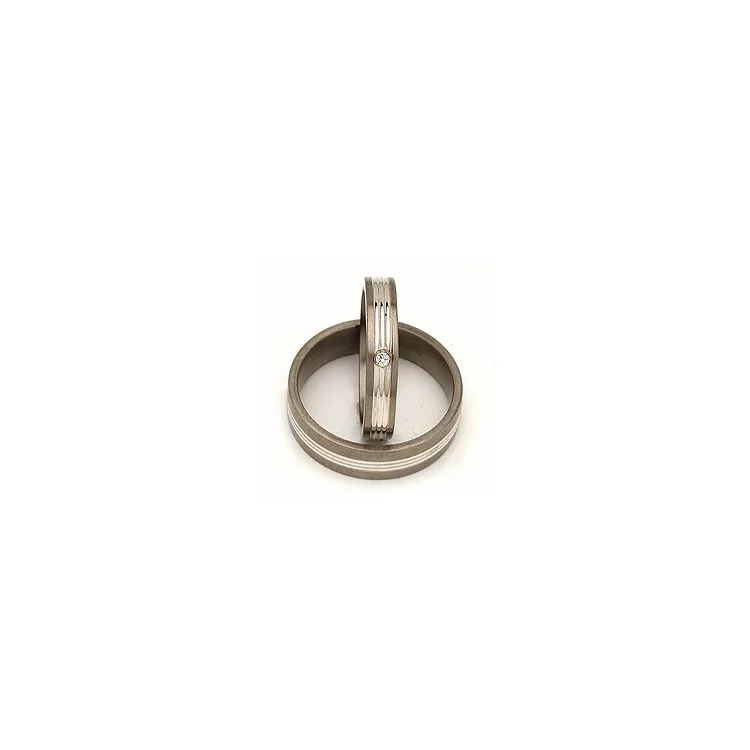 Vielsesringe i 14 karat titanium og alm. guld 0,025 ct
