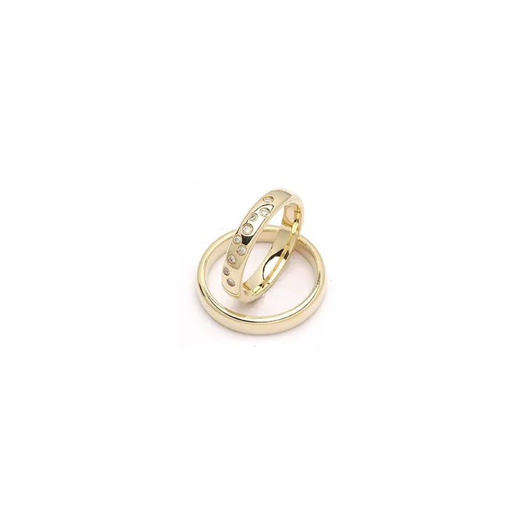 stjernedrys vielsesringe i 9 karat guld 0,126 ct - sæt