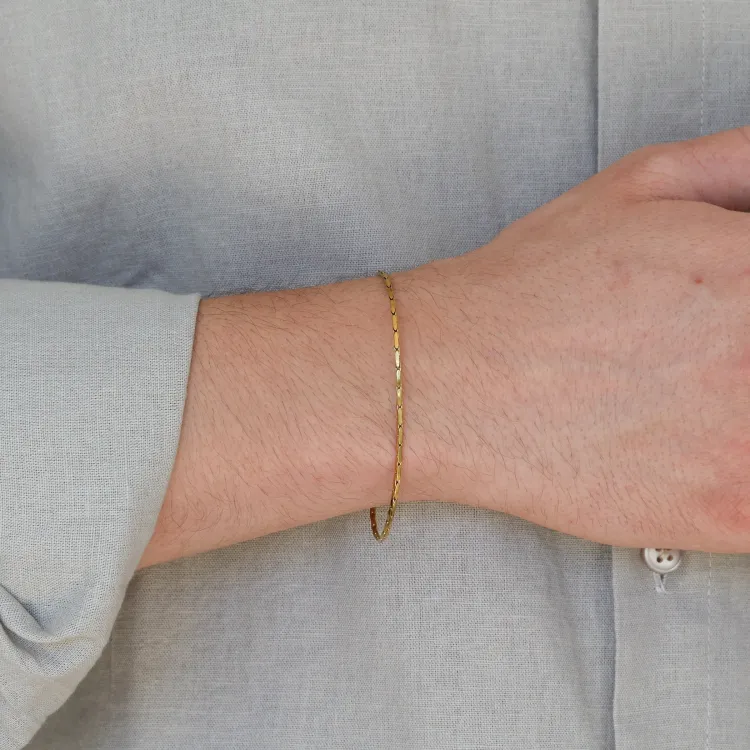 vandfast armbånd i forgyldt stål  x 1,5 mm 