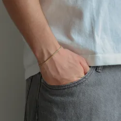 vandfast armbånd i forgyldt stål  x 3 mm 